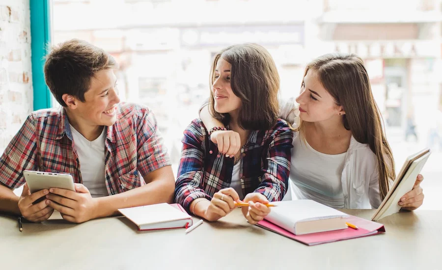 happy-students-posing-together_23-2147655868.jpg